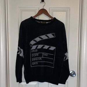 AIM by Albert Elovitz Black Crewneck Sweater – Movie Clapperboard Graphic